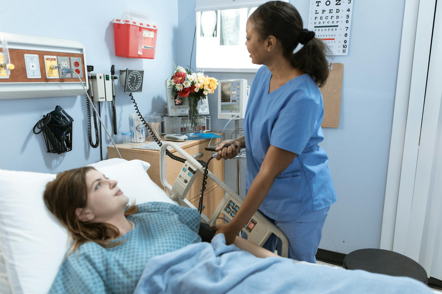 nurse measuring the blood pressure of a patient